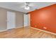 This bedroom features neutral walls, laminate flooring and a ceiling fan at 3845 Garnet Dr, Mulberry, FL 33860