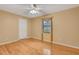 Bedroom with wood floors and window at 3845 Garnet Dr, Mulberry, FL 33860