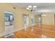 Dining area featuring a large mirror leading to kitchen with stainless appliances at 3845 Garnet Dr, Mulberry, FL 33860