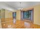 Dining room with wall mirror, and a sunlit window at 3845 Garnet Dr, Mulberry, FL 33860