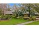 Landscaped front lawn showcasing a well-maintained home exterior at 3845 Garnet Dr, Mulberry, FL 33860