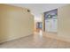 Spacious foyer with neutral tile flooring and view of dining area at 3845 Garnet Dr, Mulberry, FL 33860