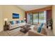 Bright living room with a view of the pool and comfortable seating arrangement at 3845 Garnet Dr, Mulberry, FL 33860