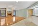Bright living room with hardwood floors, brick fireplace, and neutral paint at 3845 Garnet Dr, Mulberry, FL 33860