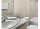 Bathroom featuring a single sink vanity with granite countertop, framed mirror, and a shower and tub combo at 5105 Sylas Jax Ave, Winter Haven, FL 33884