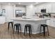 Open concept kitchen featuring an island with granite countertops, pendant lighting, and stainless appliances at 5105 Sylas Jax Ave, Winter Haven, FL 33884