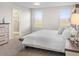 Main bedroom with neutral walls, carpet, and ensuite bath with glass shower at 5105 Sylas Jax Ave, Winter Haven, FL 33884