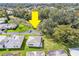 Aerial view showcasing the property's location, lush green surroundings, and proximity to mature trees at 561 Cameo Dr, Lakeland, FL 33803