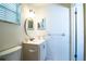 Bathroom featuring a white vanity and mirror, complemented by a toilet at 561 Cameo Dr, Lakeland, FL 33803