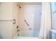 Bathroom with a shower/tub combo featuring a shower curtain and towel bar at 561 Cameo Dr, Lakeland, FL 33803