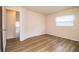 Bedroom featuring wood-look floors, neutral paint, and natural light at 561 Cameo Dr, Lakeland, FL 33803