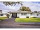 Front view of a single story house with a carport at 561 Cameo Dr, Lakeland, FL 33803