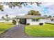 Single story home with carport and well-maintained lawn at 561 Cameo Dr, Lakeland, FL 33803