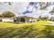 Beautifully landscaped front yard with lush green grass and attractive curb appeal at 561 Cameo Dr, Lakeland, FL 33803