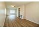 The living room with wood-look flooring, lots of space, and access to the kitchen at 561 Cameo Dr, Lakeland, FL 33803