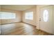 Bright living room with wood-look floors and natural light from the windows at 561 Cameo Dr, Lakeland, FL 33803