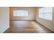 This living room has new flooring and many windows for lots of natural light at 561 Cameo Dr, Lakeland, FL 33803