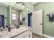 Clean bathroom with a sink, bathtub, and shower at 185 St Thomas Dr, Mulberry, FL 33860