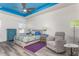 Bedroom with a bed, dresser, and relaxing armchair at 185 St Thomas Dr, Mulberry, FL 33860