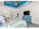 Main bedroom with large TV and ensuite bathroom at 185 St Thomas Dr, Mulberry, FL 33860