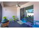 Screened porch with colorful chairs, a grill, and sliding glass doors at 185 St Thomas Dr, Mulberry, FL 33860