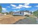 House's backyard with dry grass and a white fence at 3107 Valley High Dr, Lakeland, FL 33813