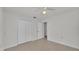 Bedroom with double door closet and tile floors at 3107 Valley High Dr, Lakeland, FL 33813