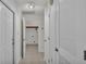 Clean hallway with access to laundry and other rooms at 3107 Valley High Dr, Lakeland, FL 33813