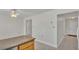 Kitchen with an island and access to the hallway at 3107 Valley High Dr, Lakeland, FL 33813