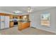 Kitchen with wood cabinets, stainless steel appliances, and an island at 3107 Valley High Dr, Lakeland, FL 33813