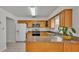 Kitchen with wood cabinets, granite countertops, and stainless steel appliances at 3107 Valley High Dr, Lakeland, FL 33813