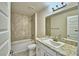 Bright bathroom featuring a tub with tile surround and a vanity at 4036 Tullamore Ln, Auburndale, FL 33823