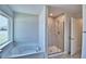 Bathroom with soaking tub and frameless glass shower at 4036 Tullamore Ln, Auburndale, FL 33823