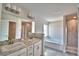 Bathroom with double sinks, large vanity, soaking tub and tiled shower at 4036 Tullamore Ln, Auburndale, FL 33823