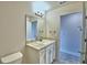 Bright bathroom featuring a vanity and a tile floor at 4036 Tullamore Ln, Auburndale, FL 33823