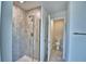 Tiled shower featuring a frameless glass door at 4036 Tullamore Ln, Auburndale, FL 33823