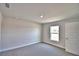 This bedroom features carpet, a window, and neutral walls at 4036 Tullamore Ln, Auburndale, FL 33823