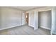 This bedroom features neutral walls, carpet, and a closet at 4036 Tullamore Ln, Auburndale, FL 33823
