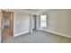 Comfortable bedroom with carpeted floors, closet, and a sun-filled window at 4036 Tullamore Ln, Auburndale, FL 33823