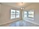 Bright dining room has tile floors and large windows offering plenty of natural light at 4036 Tullamore Ln, Auburndale, FL 33823