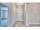 This entryway has neutral walls, tile floors, and a white door at 4036 Tullamore Ln, Auburndale, FL 33823
