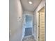 Hallway with tiled floor leads to bedrooms and closet at 4036 Tullamore Ln, Auburndale, FL 33823