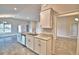 Open kitchen with island, stainless appliances, granite counters, and access to dining area at 4036 Tullamore Ln, Auburndale, FL 33823
