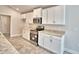 This modern kitchen features white cabinets, stainless steel appliances, and granite countertops at 4036 Tullamore Ln, Auburndale, FL 33823