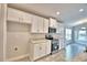 Modern kitchen features granite counters, stainless appliances, and white shaker cabinets at 4036 Tullamore Ln, Auburndale, FL 33823