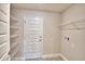 Spacious laundry room with shelving, door, and washer/dryer hookups at 4036 Tullamore Ln, Auburndale, FL 33823