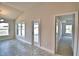 Bright living room featuring tile flooring, natural light and an entry door at 4036 Tullamore Ln, Auburndale, FL 33823