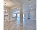 The spacious open-concept living area features neutral tile floors and lots of natural light at 4036 Tullamore Ln, Auburndale, FL 33823