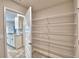 Walk-in pantry with ample shelving located just off the kitchen at 4036 Tullamore Ln, Auburndale, FL 33823