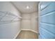 Walk-in closet featuring carpeted floor and wire shelving at 4036 Tullamore Ln, Auburndale, FL 33823